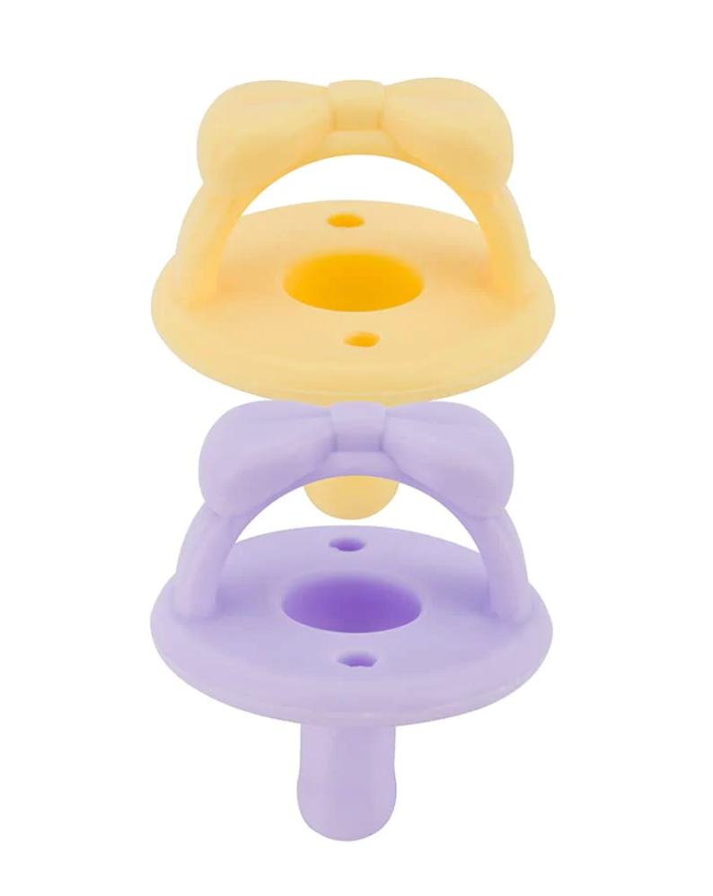 
            
                Load image into Gallery viewer, Itzy Ritzy Sweetie Soother Pacifiers // Daffodil &amp;amp; Purple Diamond Bows
            
        